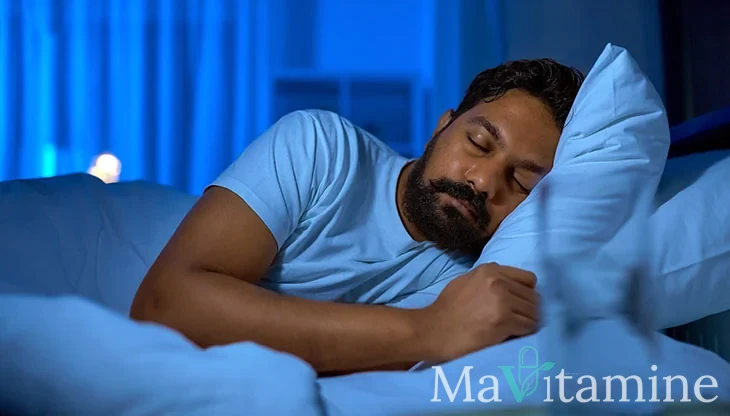 man sleeping in bed after taking melatonin and learning the side effects